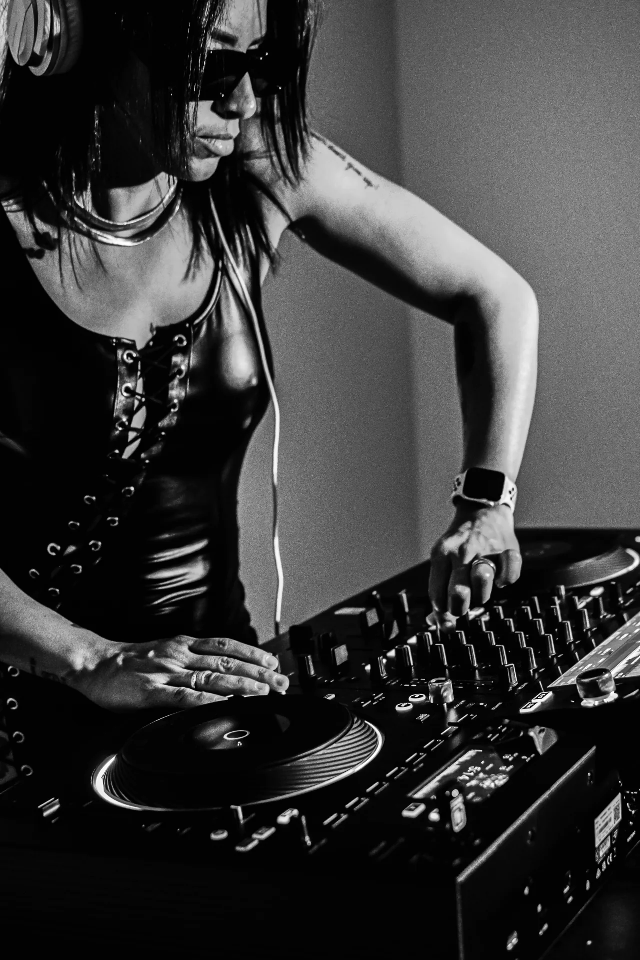 Darah leaning over the mixer